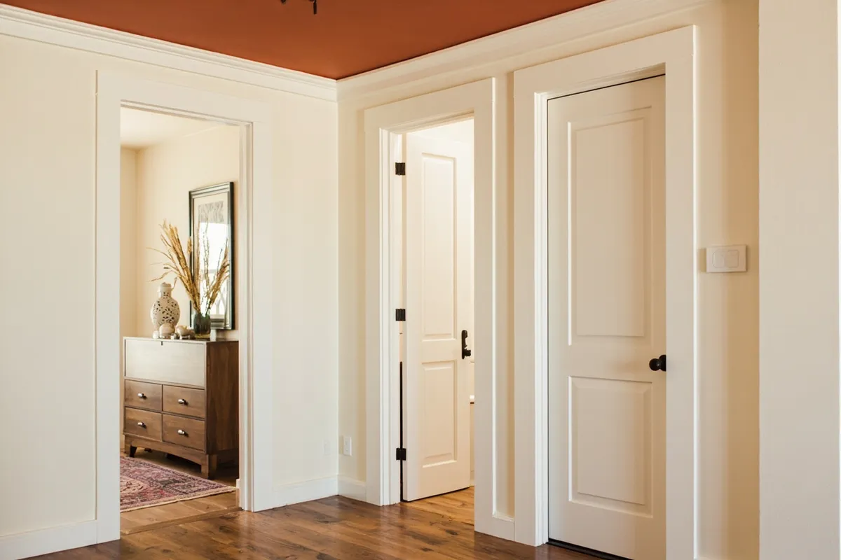 Entryway with whitewashed knotty pine walls